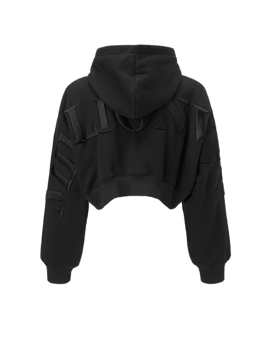 Black cropped hoodie with unique padded geometric details on the shoulders and sleeves, shown from the back against a plain white background.